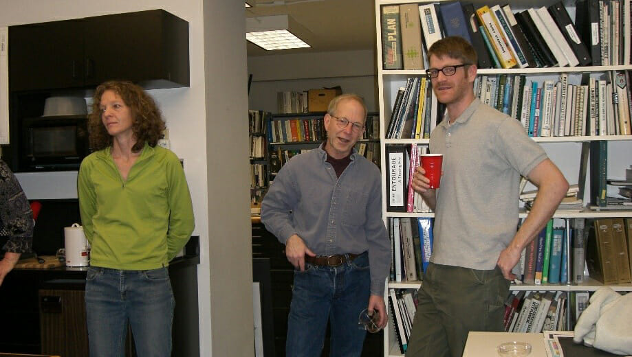 Photo of three people in an office