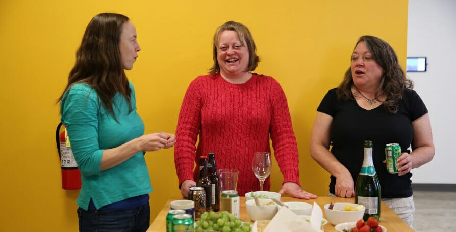 photo of three women talking