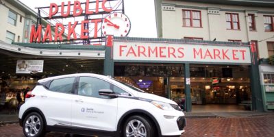 image of an electric vehicle parked at the Seattle Pike's Place Farmers Market